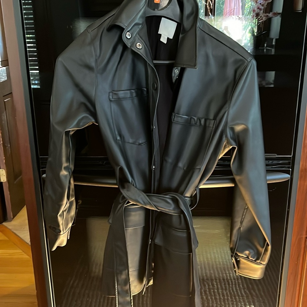 Woman’s HM black faux leather jacket with belt. Size M. Excellent condition.